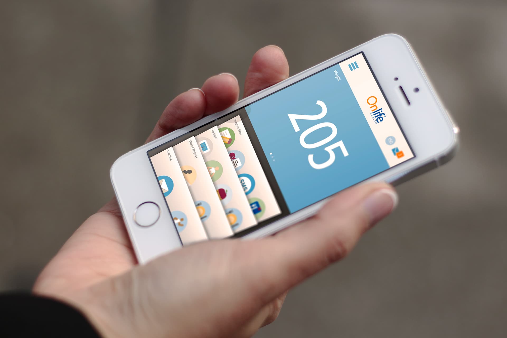 Hand holding phone showing Onlife Health app